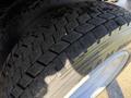 Close-up of a tire from a 2014 Hino 195 showing tread patterns and rubber texture