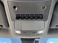 Interior overhead console of a 2020 Ford F-350 SD featuring six auxiliary switches and two built-in lights
