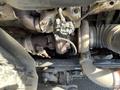 Close-up view of the engine components of a 2022 Freightliner Cascadia including the turbocharger and piping systems