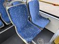 Two blue patterned seats inside a 2016 Grande West Vicinity bus with a modern design
