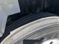 Close-up of a worn tire on a 2018 International DuraStar showing visible tread wear and dirt accumulation on the rubber surface