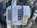 Close-up of a 2010 Kubota F3680 alternator with visible wiring and markings indicating 60A