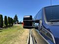 2014 Ford F-250 SD with a side mirror extending outwards