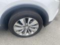 A close-up view of a silver 2018 Buick Encore's alloy wheel and tire showcasing the intricate design of the wheel and the tire brand name