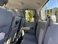Interior view of a 2016 Ford F-550 showing back seats and cabin layout with gray upholstery and seating for multiple passengers