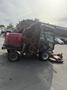 A red 2013 Toro Grounds Master 5910 with an elevated mowing deck and a cabin, designed for large turf maintenance and equipped with multiple mowing blades