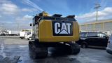 A 2018 Caterpillar 326F L Excavator with tracks and a prominent CAT logo on its rear side