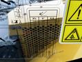 A close-up of a display panel from a 2024 Caterpillar 306 showing measurement charts and caution symbols