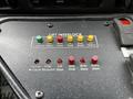 Control panel of a 2016 Ford Econoline showing various buttons for lift interlock door operations and indicators in red and yellow