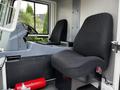 Interior of a 2007 Tennant Sentinel showing driver’s seat and passenger seat with a fire extinguisher on the floor