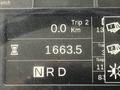 A digital display showing a trip meter reading 0 km a total distance of 16663.5 km and an indicator marked NRD