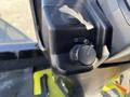 Close-up of the control panel of a 2010 Kubota F3990 featuring a circular dial and a switch for adjusting speed or functions