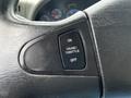 Close-up of the steering wheel controls of a 2017 International WorkStar 7600 showing the cruise throttle switch labeled on and off