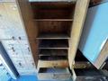 The image shows the interior of a 2009 Morgan Olson Workhorse featuring multiple wooden shelves and drawers with brass handles