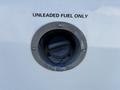 Gas cap of a 2017 Chevrolet Express with a label stating unleaded fuel only