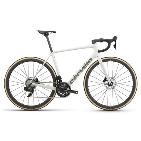 Cervelo R5 Force AXS 2025 road bike featuring a sleek white frame black handlebars and gold-accented tires