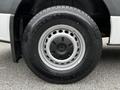 A close-up of a wheel and tire from a 2020 Mercedes-Benz Sprinter featuring a five-spoke steel rim and a rugged all-terrain tire design