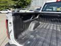 A 2016 GMC Sierra 1500 truck bed showing a black rubber liner with no visible cargo or items inside