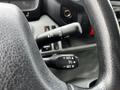 Close-up of the steering wheel controls in a 2019 Hino 195 featuring buttons for cruise control settings including plus reset and cancel functions