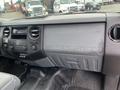 Dashboard of a 2011 Ford F-250 SD featuring the Super Duty logo with controls and a radio display