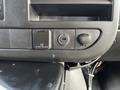 Close-up of the control panel in a 2017 Chevrolet Express showing a power outlet a USB port and a volume knob