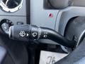 A close-up view of a 2011 Ford F-750 stalk control featuring symbols for wipers headlights and turn signals