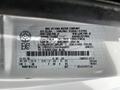 Label of a 2004 Ford Econoline showing manufacturing details and vehicle specifications including weight and dimensions