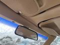 Interior view of a vintage 1970 Chevrolet Corvette showcasing the roof lining rearview mirror and sun visor
