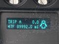Display screen showing trip details with a mileage reading of 89992.0 miles and a temperature of 47F
