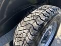 Close-up of a 2011 Chevrolet Colorado tire showcasing its tread pattern and wheel rim