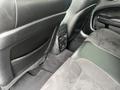 Interior view of the back seat of a 2022 Dodge Charger featuring black leather and suede upholstery with controls for climate and charging ports visible