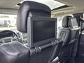 The back of a 2015 Dodge Durango's front seats featuring headrests with integrated screens for rear passenger entertainment