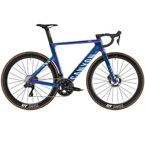 2025 Canyon Aeroad CFR Di2 Road Bike featuring a sleek aerodynamic design with a vibrant color gradient and high-performance wheels from DT Swiss