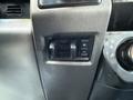 Control panel with a switch featuring a plus and minus sign, used for adjusting settings in a 2020 Ford F-550