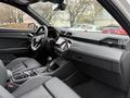 Interior view of a 2024 Audi Q3 showcasing leather seats a modern dashboard and a central touchscreen display
