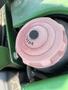 A close-up view of a pink diesel fuel cap on a 2012 John Deere 1445 SERIES II 4WD tractor