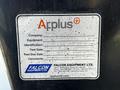 A metal label on a Freightliner M2 112 truck detailing company name equipment type test date and contact information