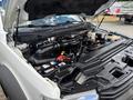 A 2017 Ford F-550 with its hood open showing the engine compartment including various components like the air intake battery and hoses