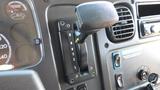 Close-up of the gear shift lever for a 2014 Freightliner Thomas Bus Diesel showing positions for reverse neutral drive and low gear