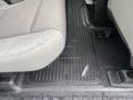 The image shows the floor of a 2017 Ford F-250 SD with a textured rubber floor mat and a beige fabric seat partially visible