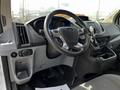 Interior view of a 2018 Ford Transit showcasing the steering wheel dashboard and central console features