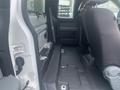 Interior view of a 2013 Ford F-150 showing the back seat area with a focus on the floor and seat configuration