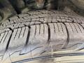 Close-up of a tire tread from a 2019 Dodge Charger showing detailed patterns and grooves designed for traction and performance