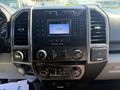 Dashboard of a 2018 Ford F-150 featuring a digital display audio system with various control buttons and knobs