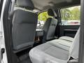Interior view of a 2016 Ford F-550 showcasing the front seats and passenger compartment with gray upholstery and fabric seating