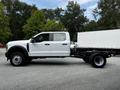 A white 2024 Ford F-550 chassis cab truck with a flatbed frame visible from the side
