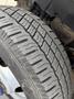 Close-up of a tire tread on a 2018 Chevrolet Express showing deep grooves and wear patterns indicating usage
