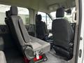 Interior of a 2021 Ford Transit showing black fabric seats with two front passenger seats and one rear seat visible