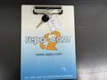 A 2014 Chevrolet Express van key attached to a clipboard displaying the repo.com logo and text about unfinished business