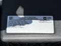 Label detailing vehicle emission control information for a 2021 Chevrolet Silverado 1500 including compliance with regulations and engine specifications